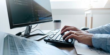 technology management
new technology
businessman typing on keyboard
computer monitor
computer mouse