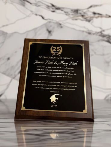 Plaque honoring James Fish &amp; Amy Fish for 25 years of dedication.