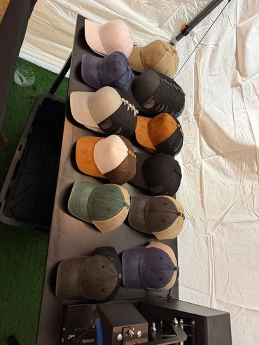 A collection of various colored caps arranged on a table.