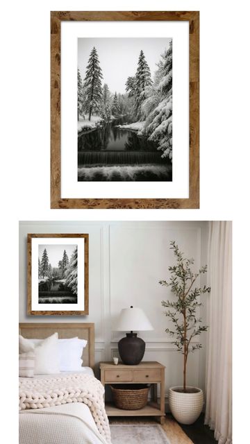 Framed black and white winter forest photo above cozy bedroom nightstand.