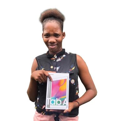 GLLA awards tablet to Laurine Thomas, student of the Programme for Adolescent Mothers, in Grenada