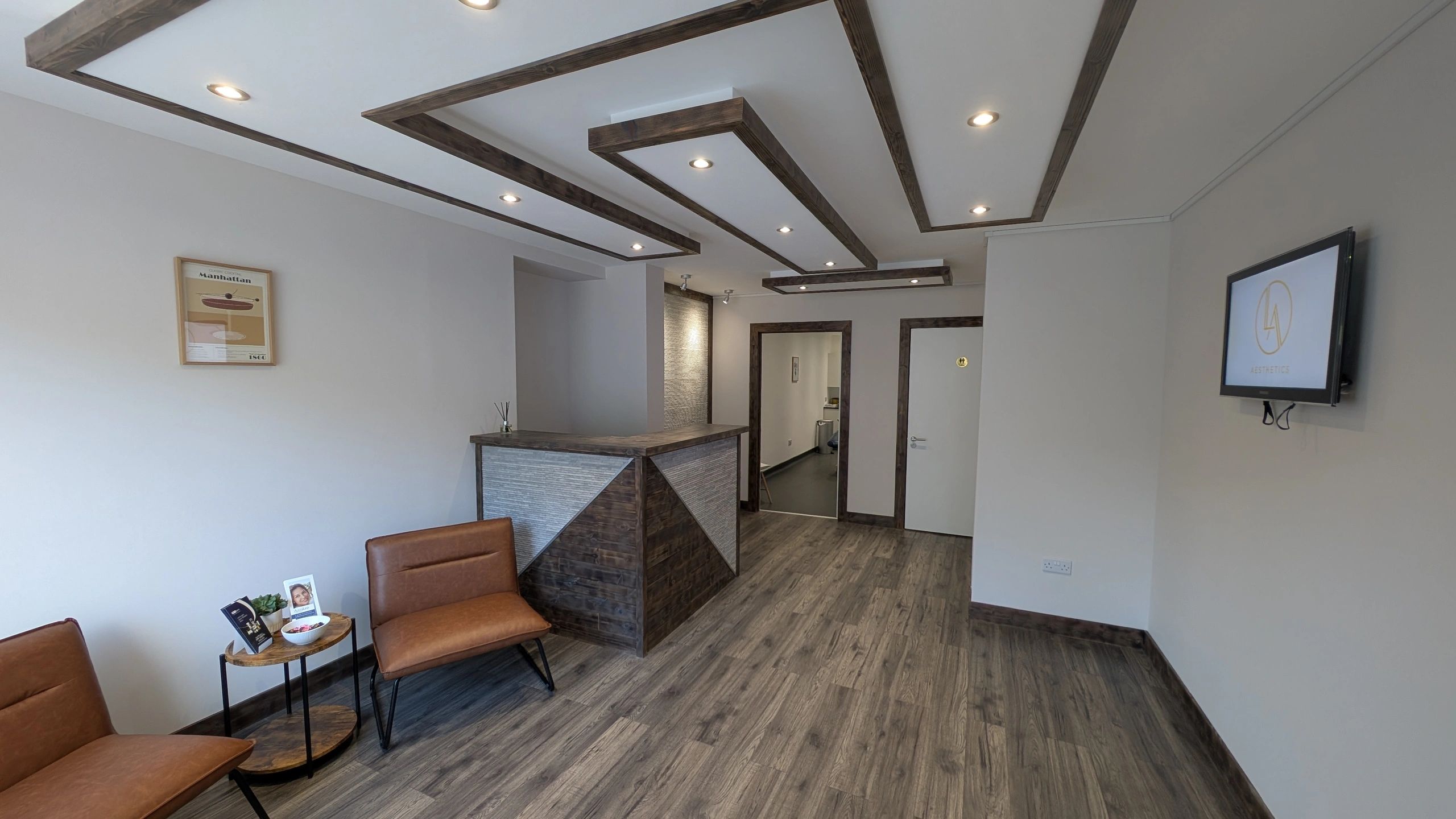Modern waiting area with wooden accents and leather chairs.
