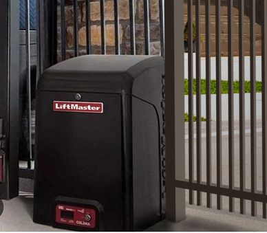 LiftMaster gate opener installed beside a metal gate.