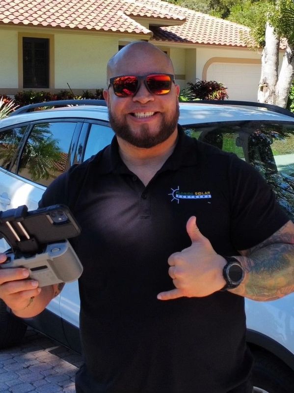 Seth taking drone pictures at a client's house