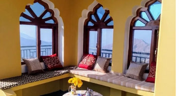 Afternoon tea on roof overlooking sunset and the himalayas 