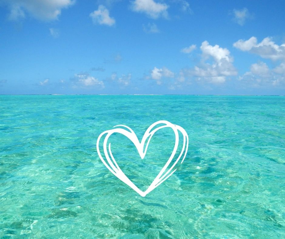 Clear blue water and fluffy clouds. 