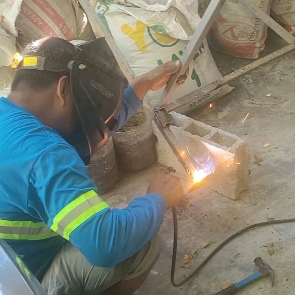 Man welding.