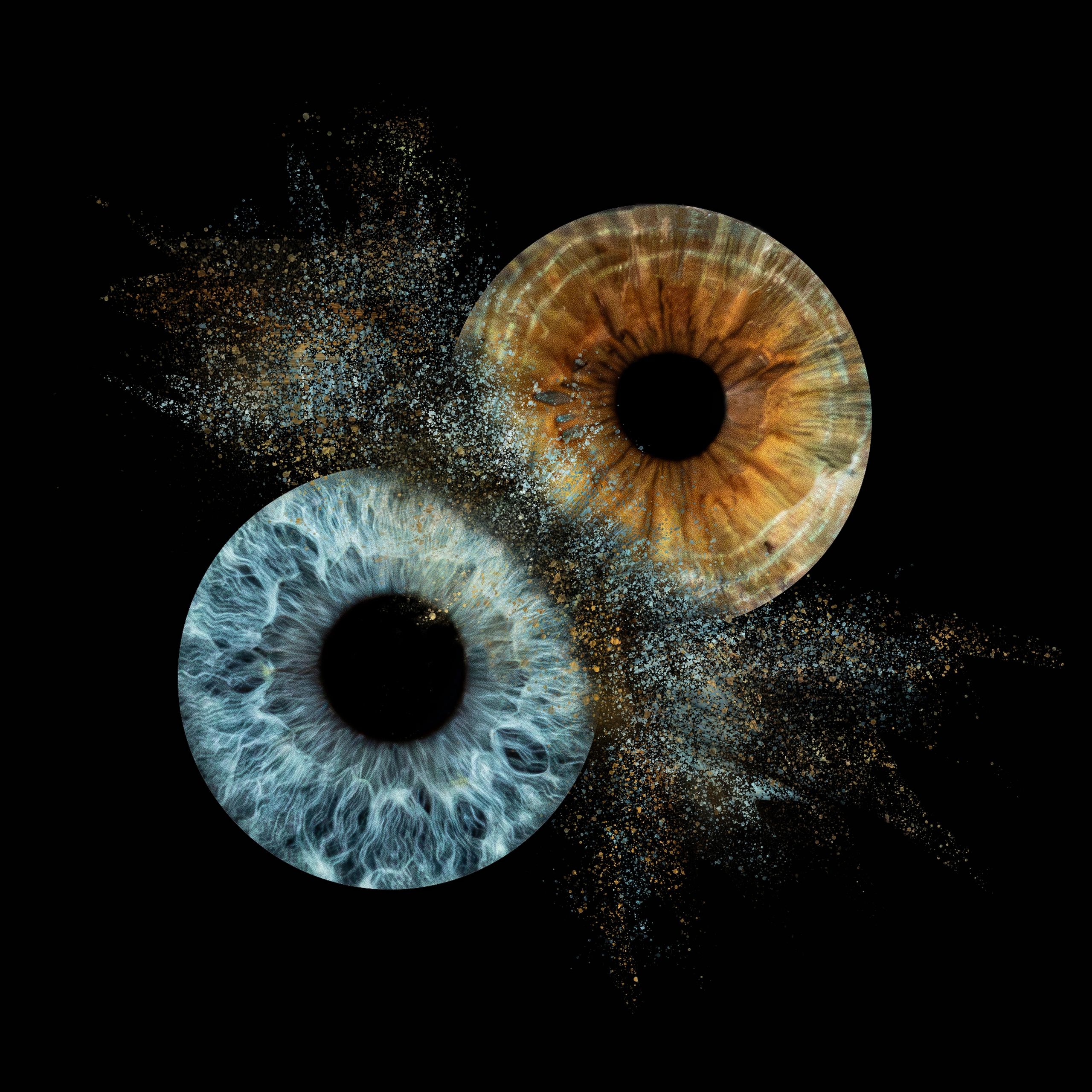 Two colorful digital eyes with particles spreading out.
