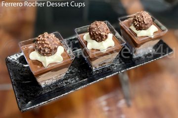 Three Ferrero Rocher dessert cups with creamy layers and chocolate topping.