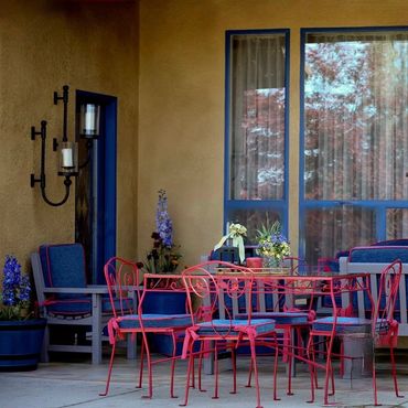 Playful Mediterranean outdoor patio in pink and blue 