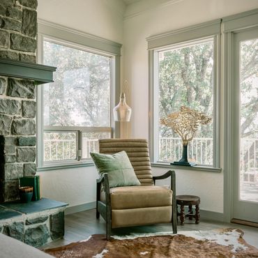 Mid mod cape cod fusion with leather recliner arc floor lamp and stone fireplace