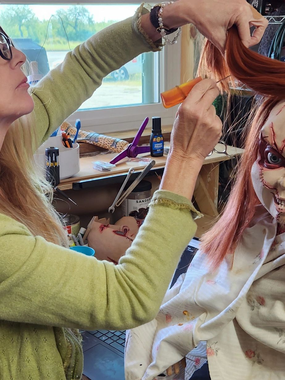 Christie of Christie's repeat boutique and my wife putting final touches on chucky