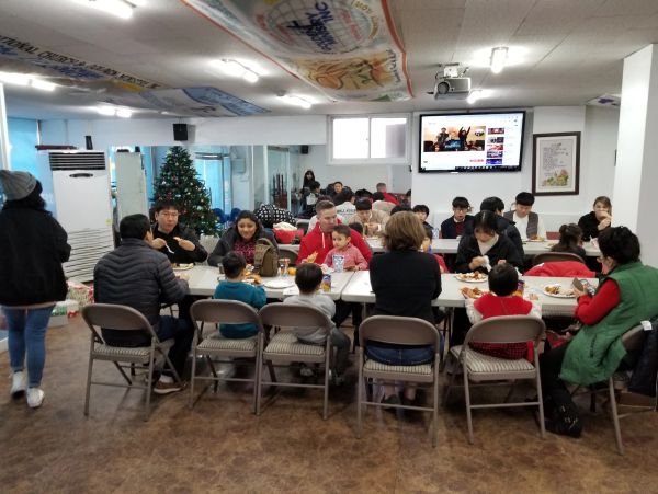 Group enjoying a meal together indoors.