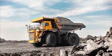 Large mining dump truck loaded with rocks.