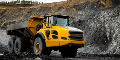 Yellow mining dump truck in a quarry.
