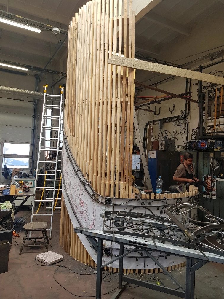Curved timber staircase structure taking shape in the workshop