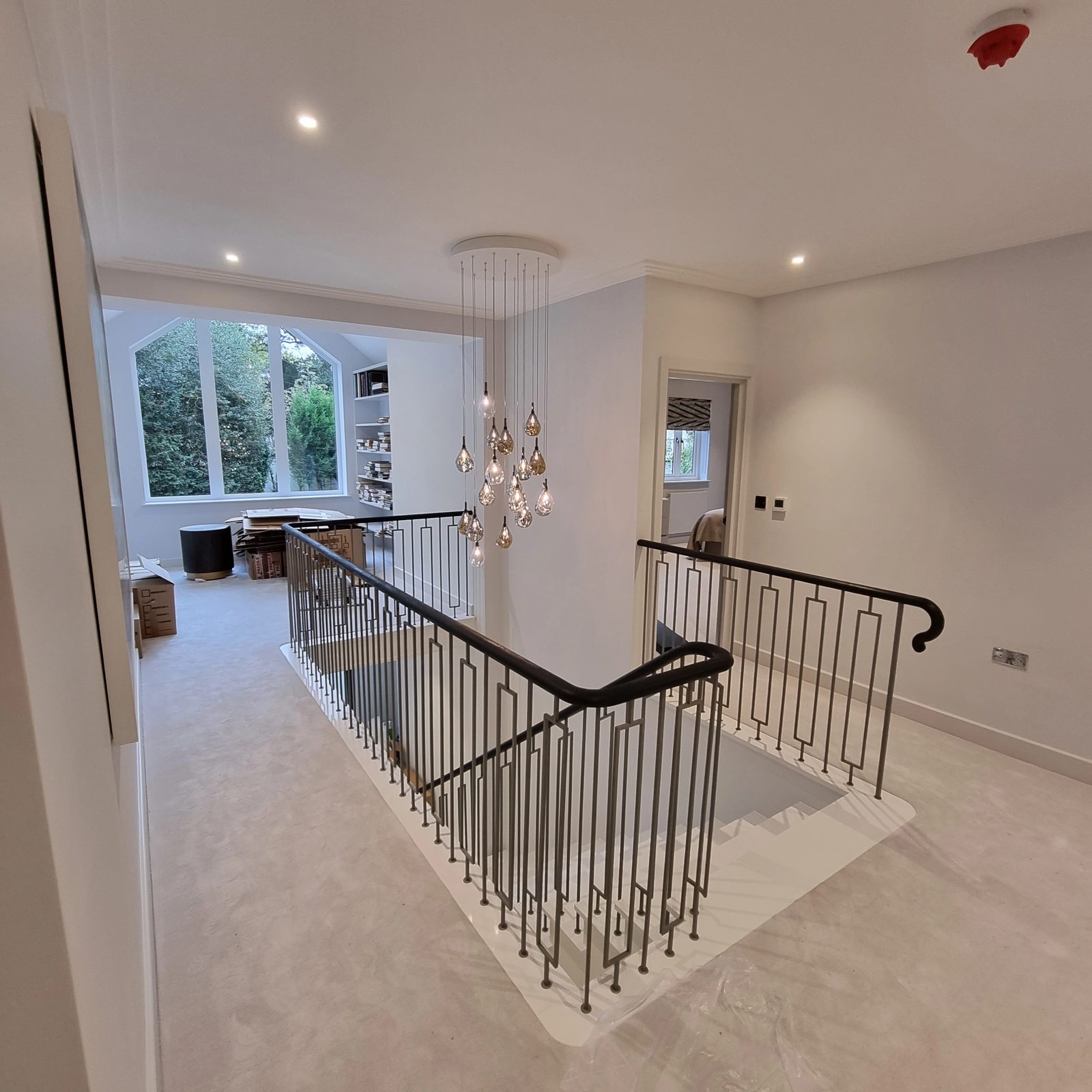 Hand-formed wrought ironwork balustrade on a galleried landing