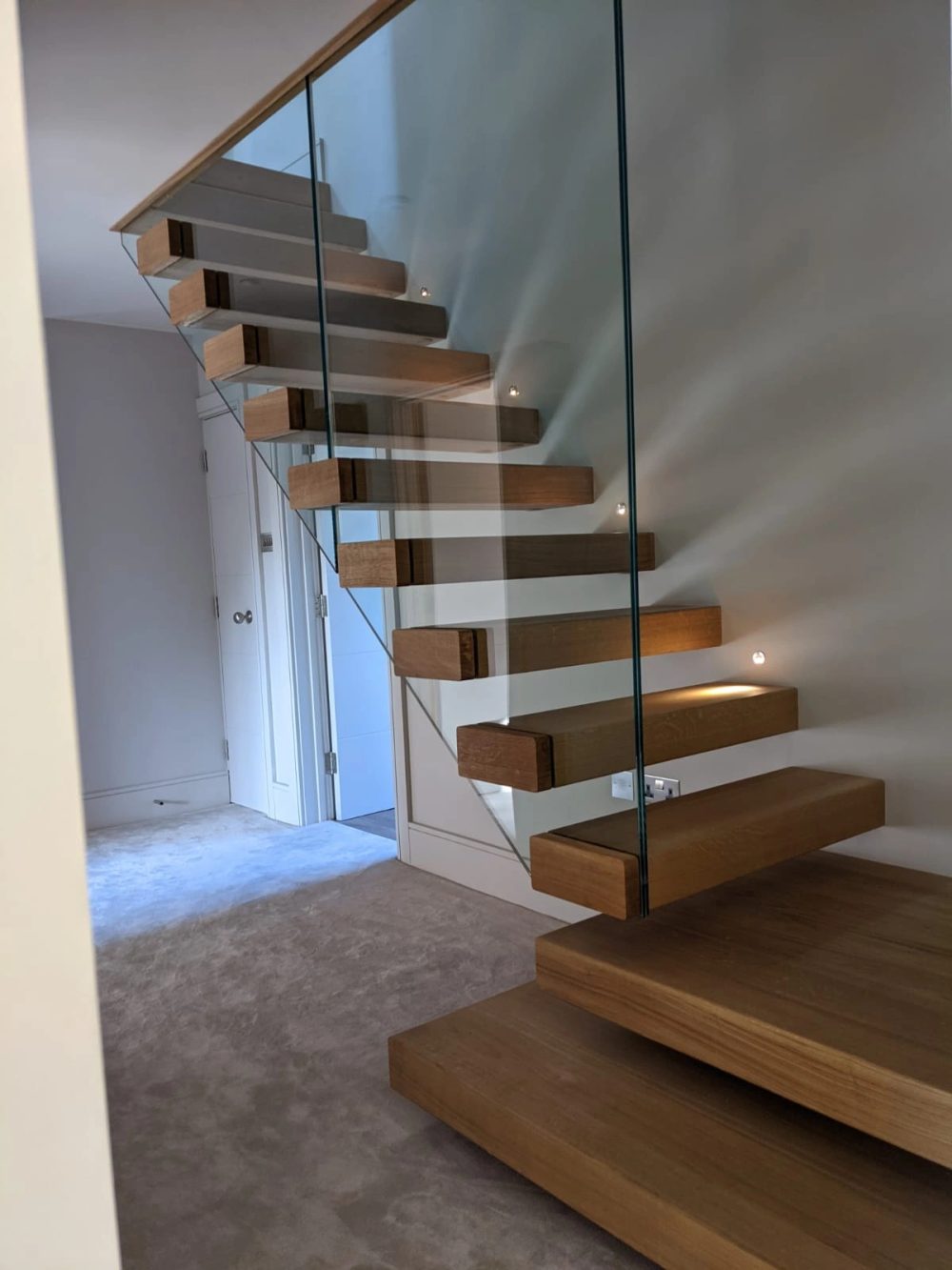 Cantilevered timber treads with frameless glass balustrade