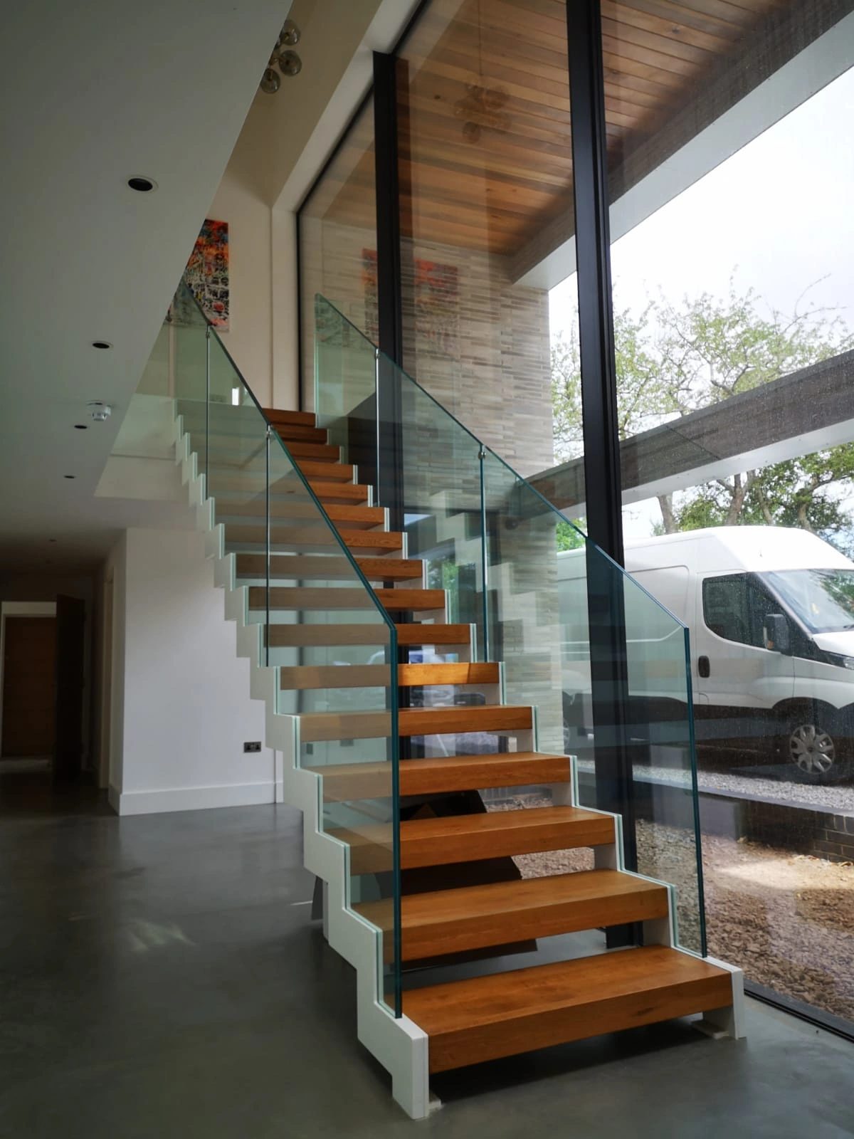 Completed staircase with structural glass balustrade