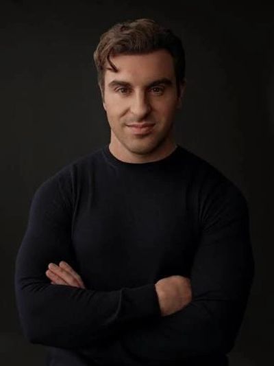 Man with crossed arms and confident expression