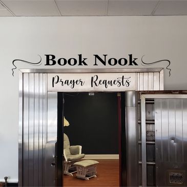 There is a prayer wall in the book nook, which is an old bank vault 