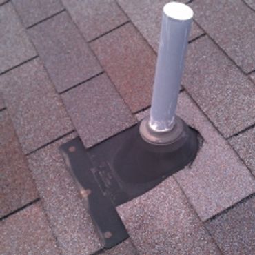 Roof vent pipe with flashing on asphalt shingle roof.