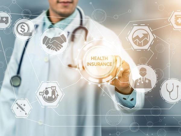 Health Insurance Concept - Doctor in hospital with health insurance