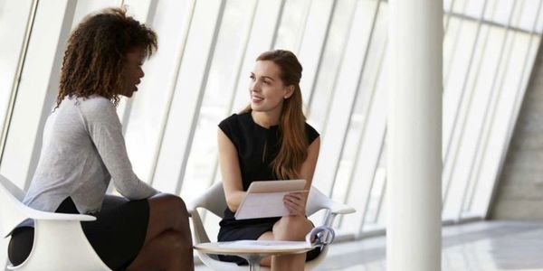 women talking together in concierge agent