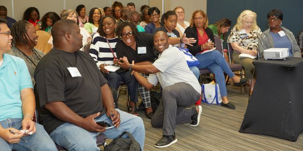 Happy attendees in session.