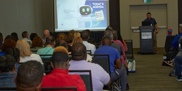 Attendees in session.