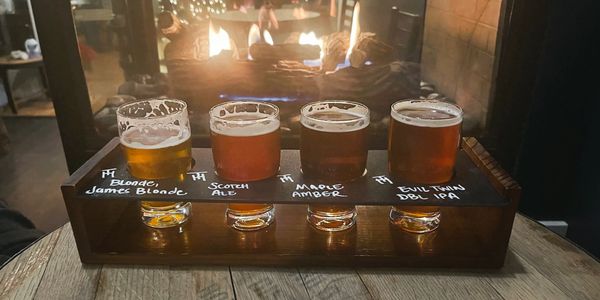 Temperate Habits Brewery Craft Beer Flight next to our fireplace