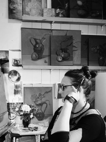Black and white image of the reputable NZ artist Jonette Murray in her studio
