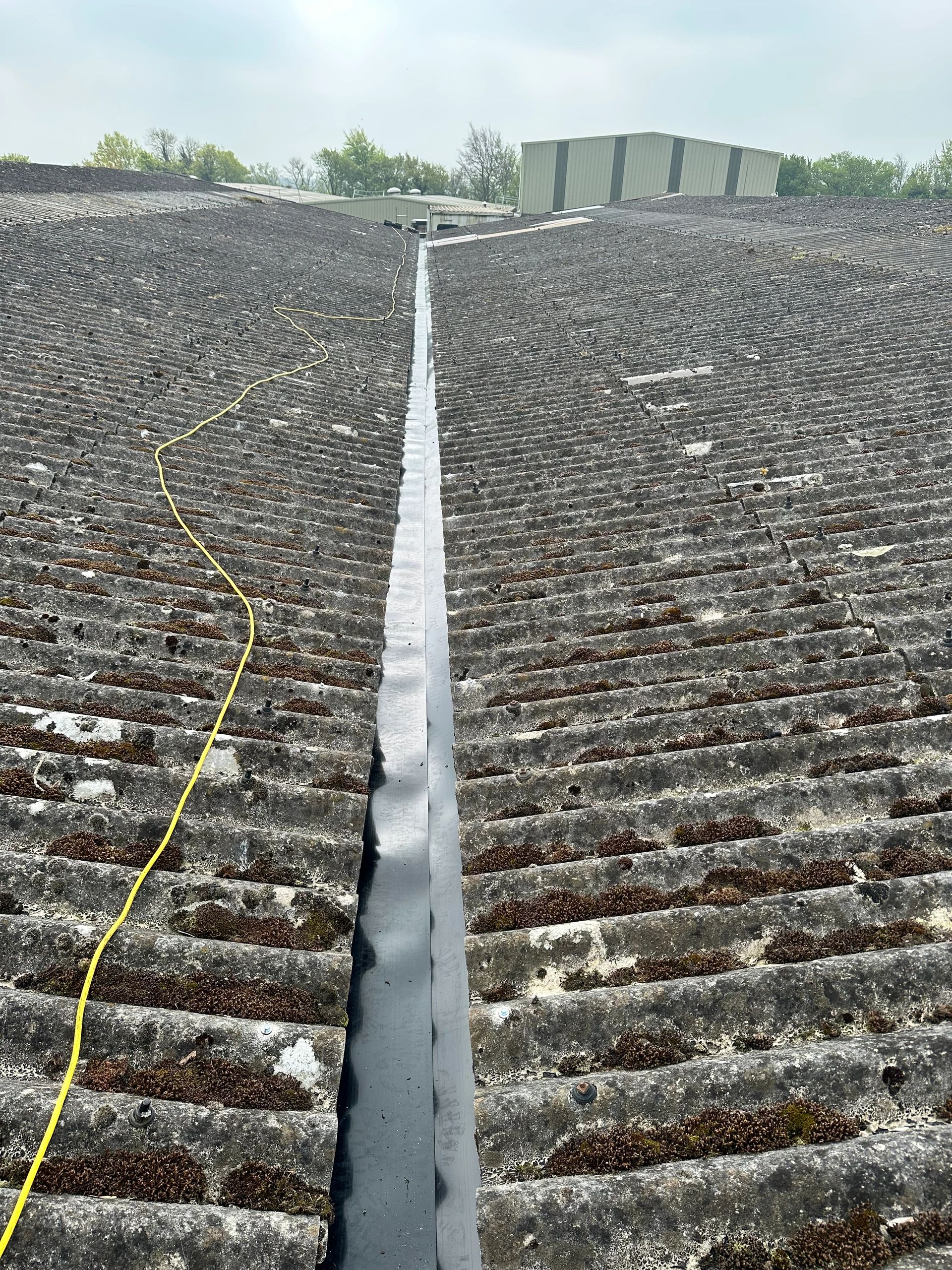 Agricultural concrete valley gutter  lined with H D SHARMAN PLYGENE GUTTER LINER .
RUBBER LINER 