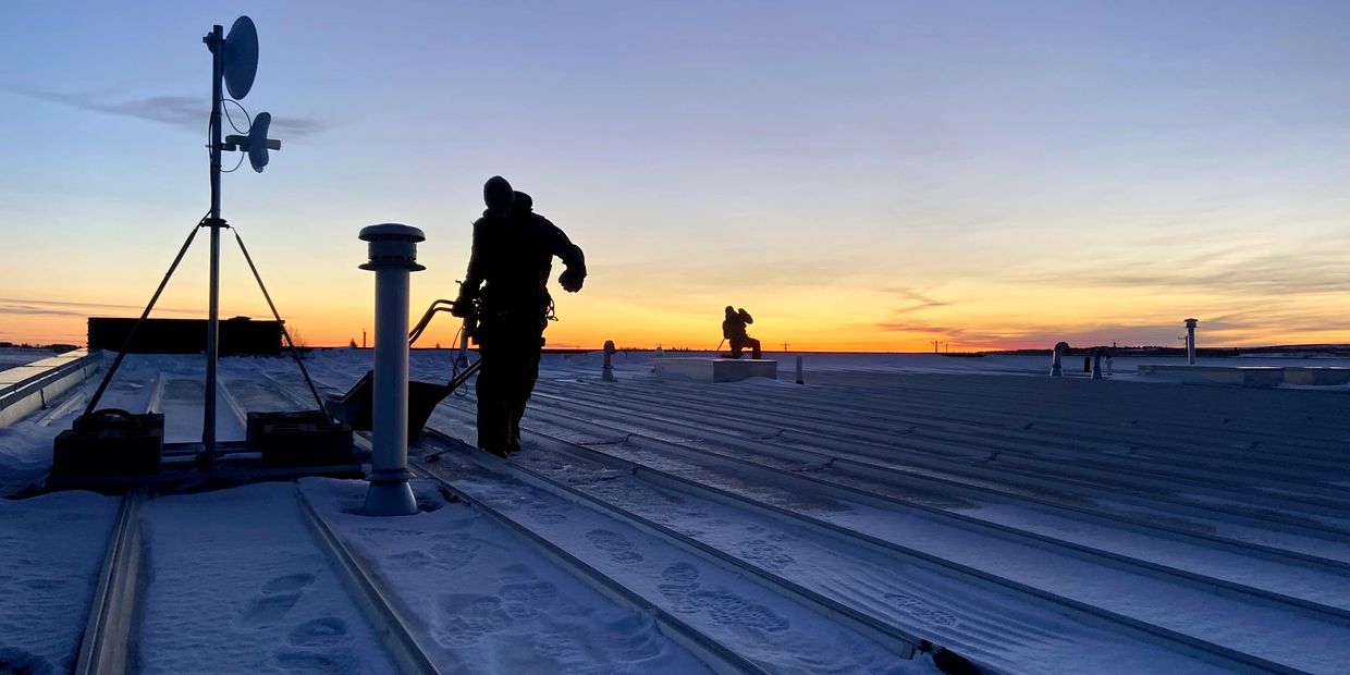 Shovelling snow of roof 