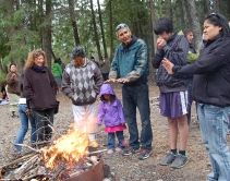 Participants at Chinook fry release keep warm
