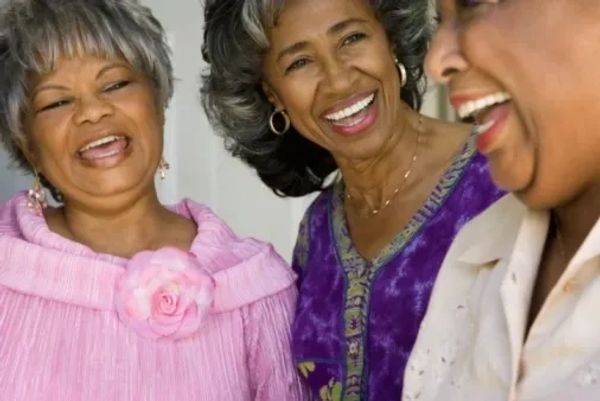 Group of Black women smiling.