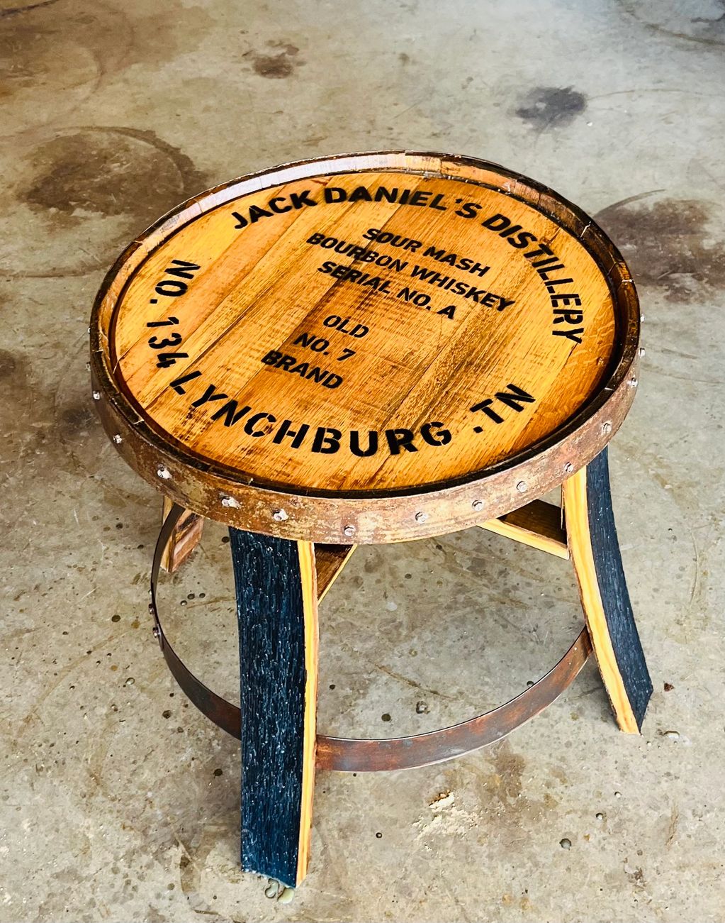 These are our custom made end tables. We use the top of a whiskey barrel and staves for legs.