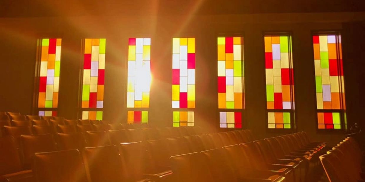 Sun streaming through windows and over seats at Unity of Columbus sanctuary, Photo: Christina Pagan