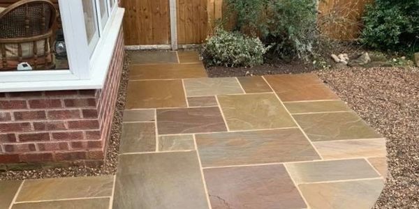 Newly laid multicolored stone patio with clean lines and natural textures.