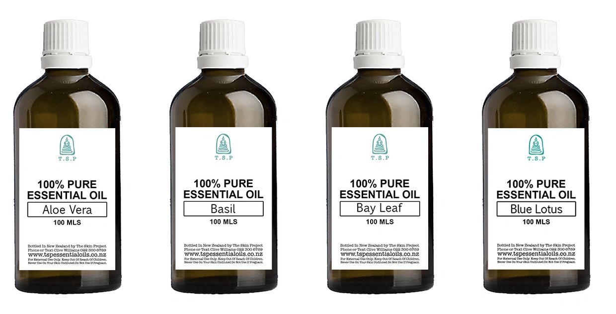 Four bottles of 100% pure essential oils with different labels.
