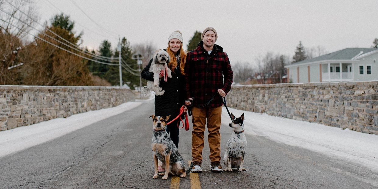 Photo of Megan And Kody with three dogs