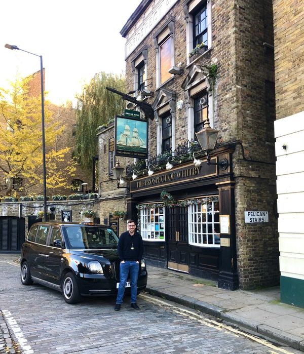 Daniel McIntyre on a black cab tour of London outside the Prospect of Whitby