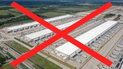 A large industrial complex marked with a red X.