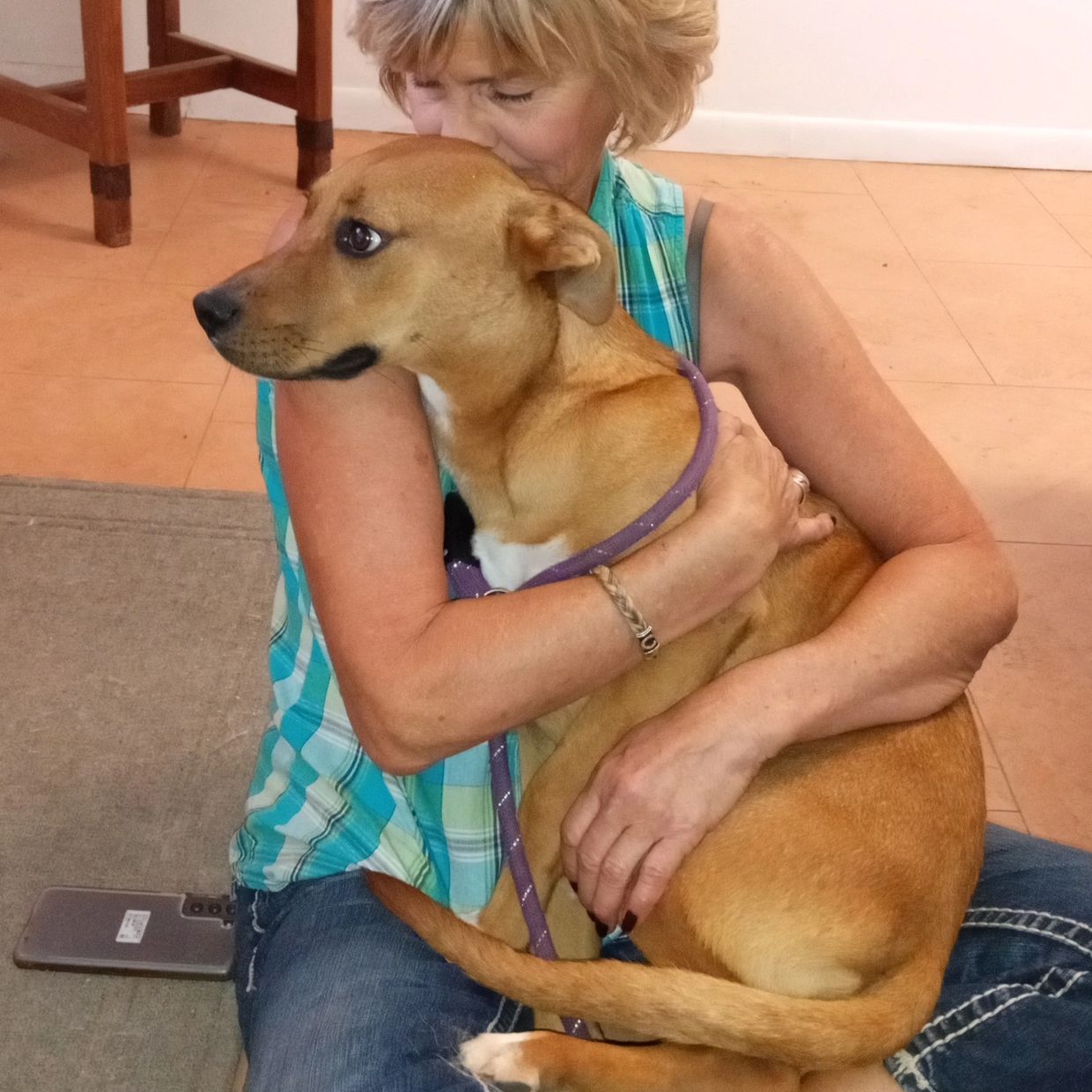 Once scheduled for euthanasia at the Douglas shelter, Lola was rescued, and is now in the arms of he