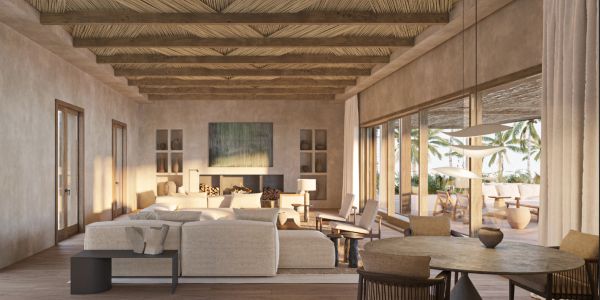 Elegant living room with natural light and wooden ceiling beams.