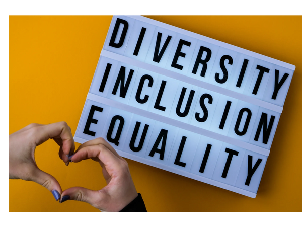 Sign showing Diversity, Inclusion and Equality and two hands and fingers shaped like a heart. 