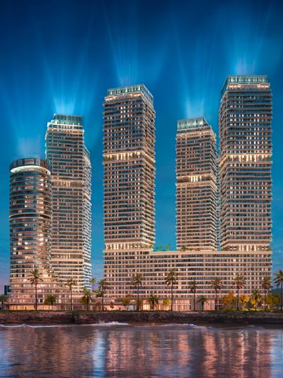 Night view of Coralia Condos, a luxury mixed-use development in Santo Domingo East featuring modern residential towers and waterfront living.