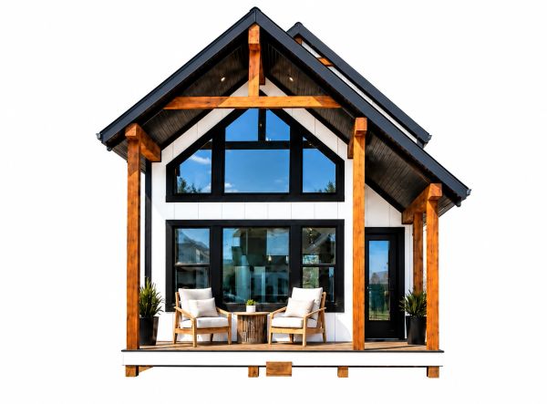 Modern tiny house with wooden accents and large windows.