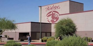 Exterior view of Ridge school building with logo.