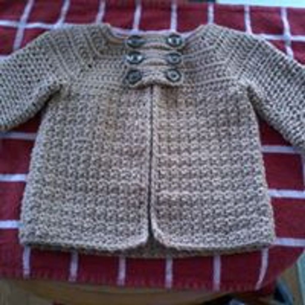 Crocheted toddler jacket in beige yarn